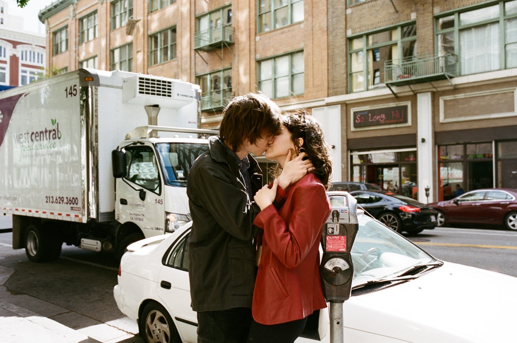 couple kissing on street